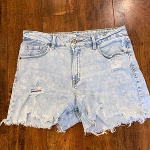 light wash distressed denim shorts.